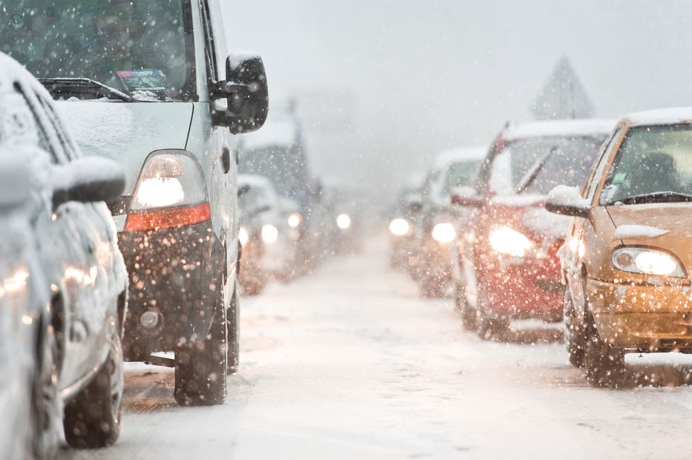 Cars in traffic on snowy roads