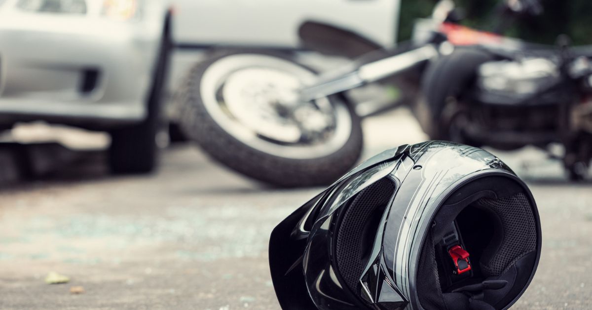 Abandoned motorcycle helmet lying on the ground after a car accident