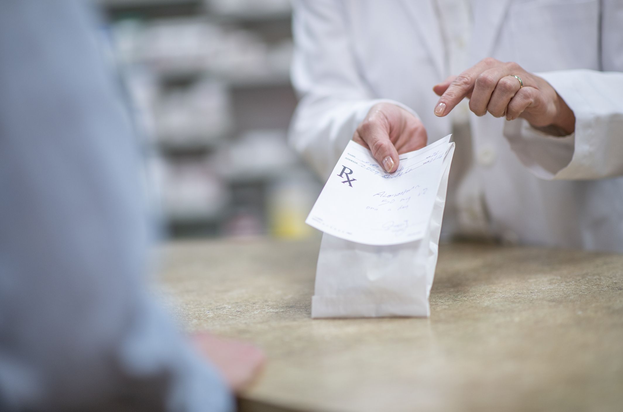getting prescription from pharmacist