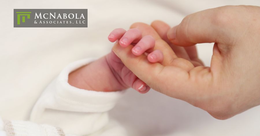 person holding a baby's hand